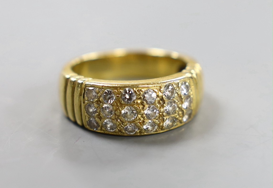 A yellow metal and eighteen stone pave set diamond ring, size Q/R